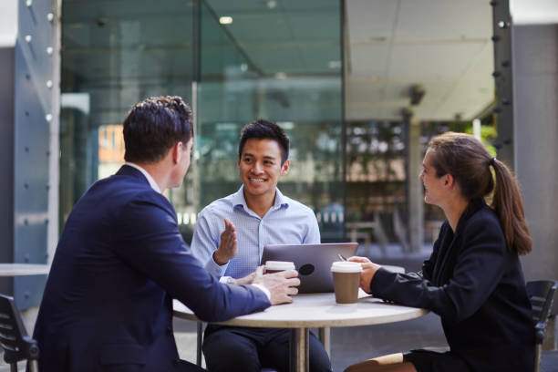 istock Corporate business meeting outdoors on the move. 921609268