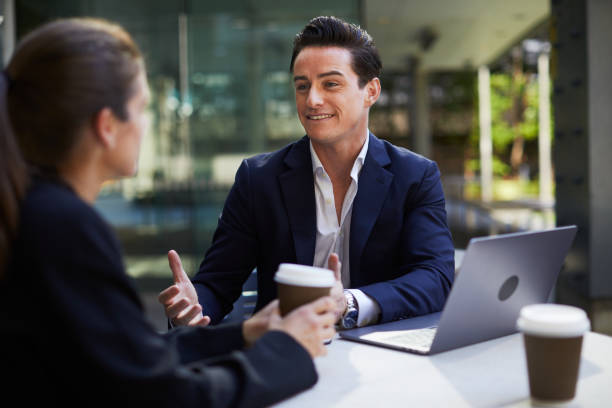 istock Corporate business meeting outdoors on the move. 921609334