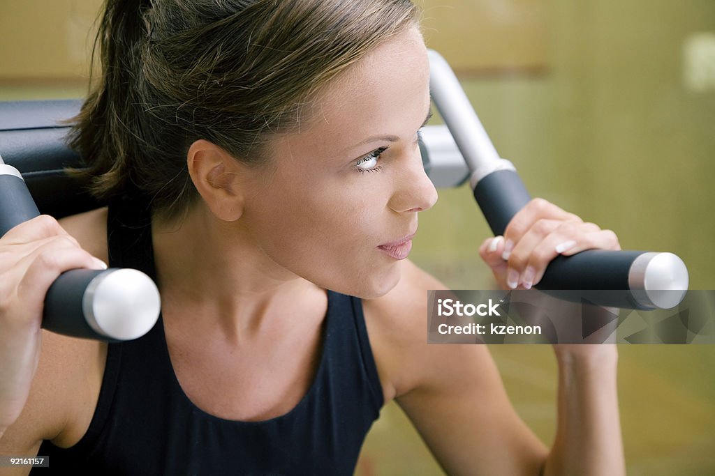 Woman working out in gym  Adult Stock Photo