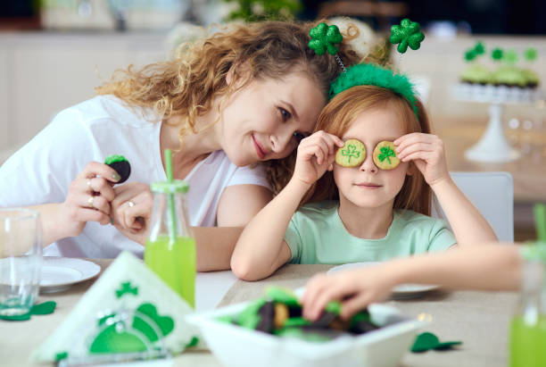 Mother with her child having a fun Mother with her child having a fun st. patricks day photos stock pictures, royalty-free photos & images