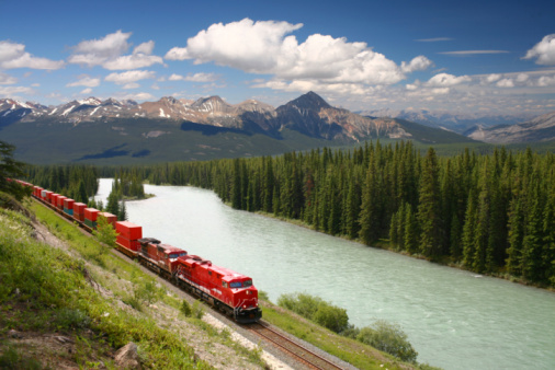 Moose Lake and CN Freight Train in Mount Robson Provincial Park, BC, Canada in summer.