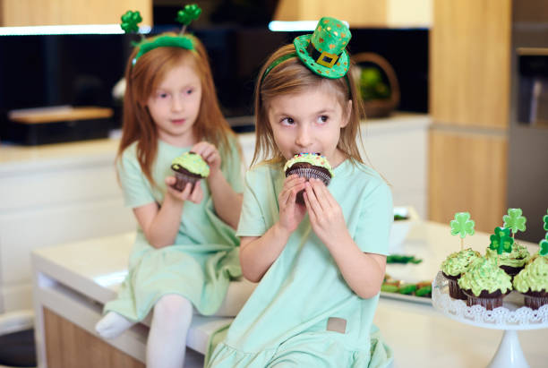 istock Portrait of children eating cupcake 921620648