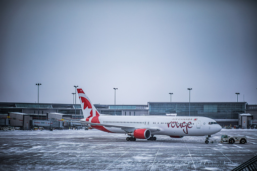 MONTREAL, CANADA _March 16th 2017. Air Canada Rouge Airplane on the Ground in YUL Airport in Montreal