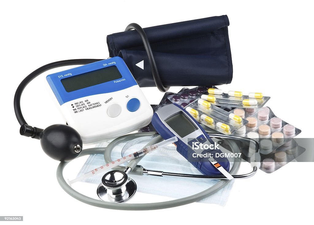 Various colour pills and medical tools Various colour pills and medical tools on a white background Assistance Stock Photo