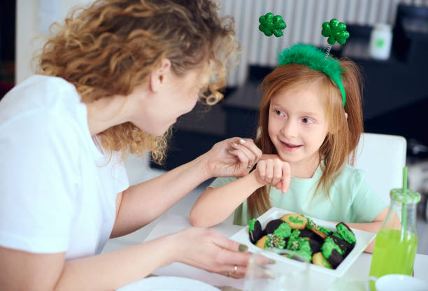 istock Cheerful mother tickling her daughter 921636498
