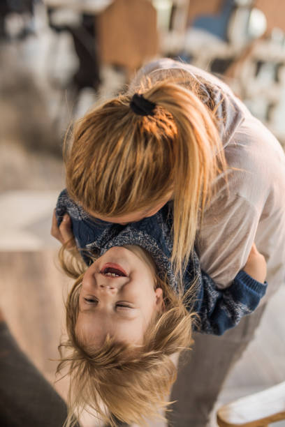 istock Playful mother and her small son having fun together. 921638844
