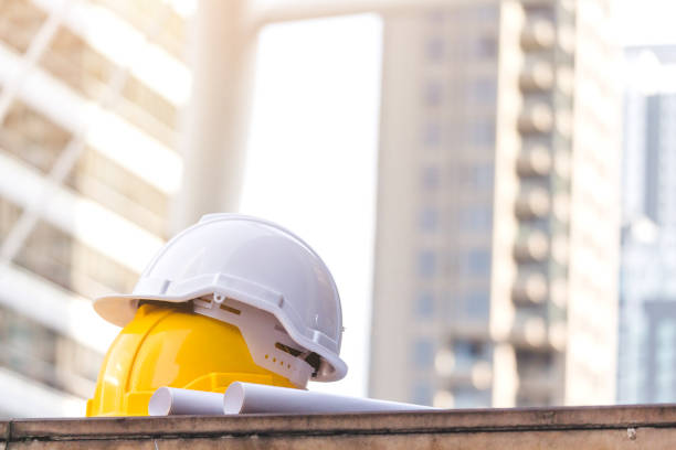 istock Helmet hat safety on the city background 921639030