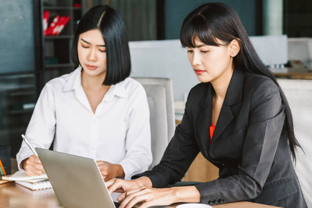 istock Image two business partners talking and working together.Business concept 921639136