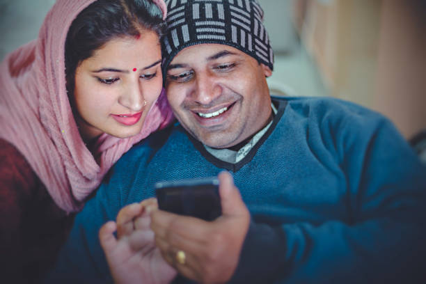 istock Couple sharing smart phone together. 921640344