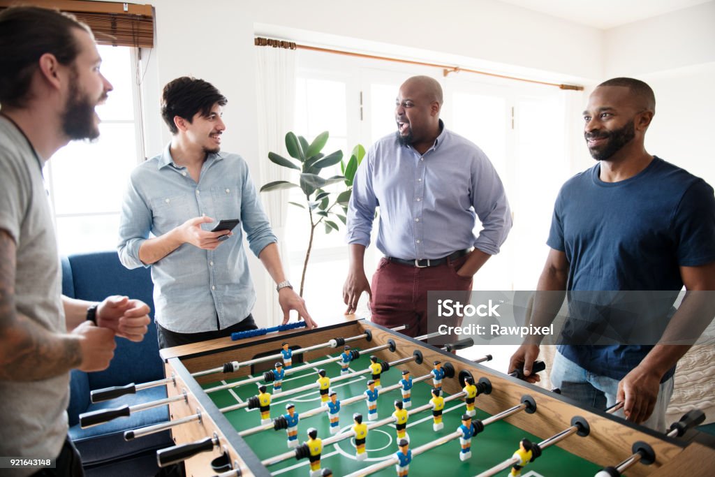 People playing table football Games Room Stock Photo