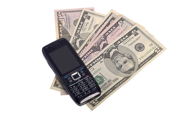 Mobile phone and money stock photo