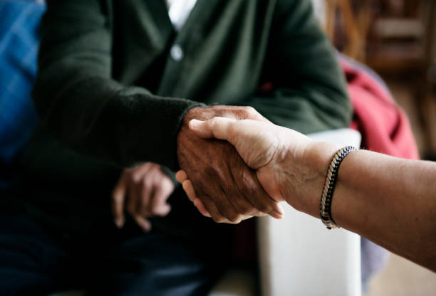 istock Senior people casual greeting shaking hands 921653802