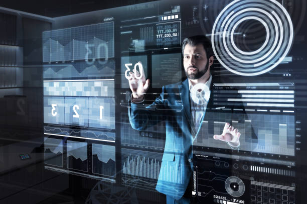 istock Reliable specialist working with numbers on the screen and looking careful 921654334