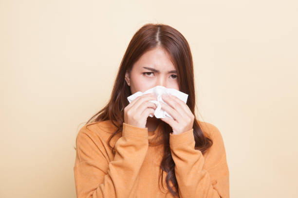 istock Young Asian woman got sick and flu. 921654720