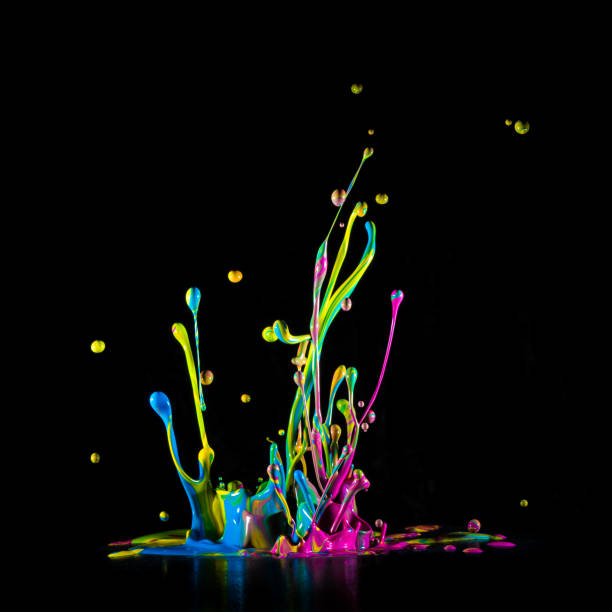 istock Colour paint splashes isolated on black background 921659024