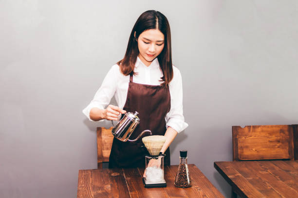 istock Women Barista making drip coffee in the cafe 921659746