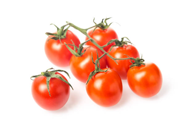 istock Fresh juicy red cherry tomato bunch closeup isolated on white background. 921661054