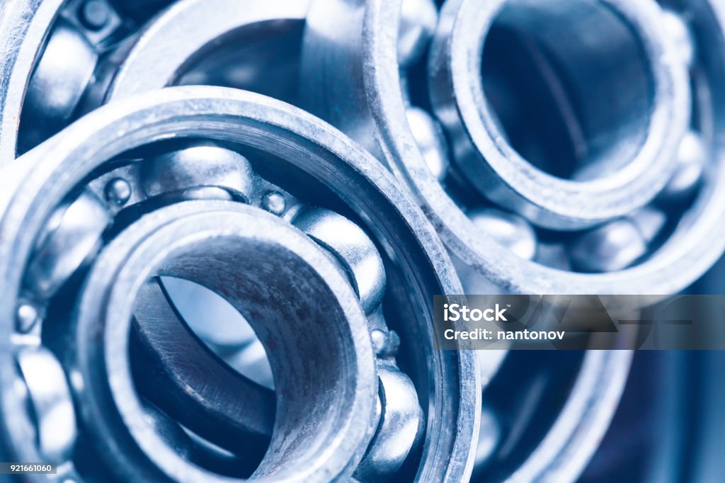 Group of various ball bearings as a background. Close up image with selective focus. Machinery background. Group of various ball bearings as a background. Close up image with selective focus. Machinery background Ball Bearing Stock Photo
