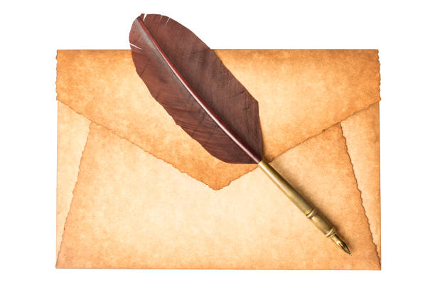istock Old vintage burned envelope letter with quill feather pen isolated on a white background 921661086