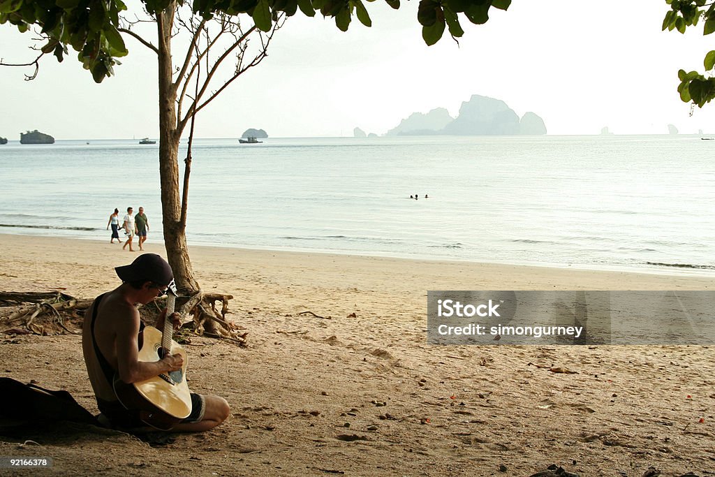 guitar man krabi beach thailand  20-29 Years Stock Photo