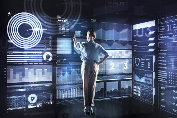 istock Elegant database administrator looking at the screen and pointing to it 921665044