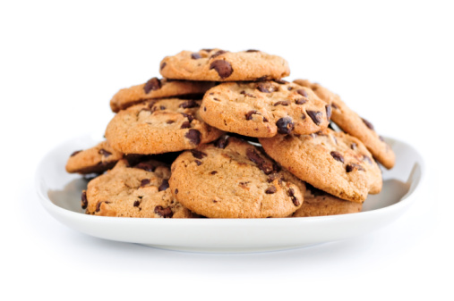 Plate of chocolate chip cookies isolated on white background