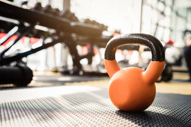 istock dumbbells and barbells for weightlifting in gym 921670772