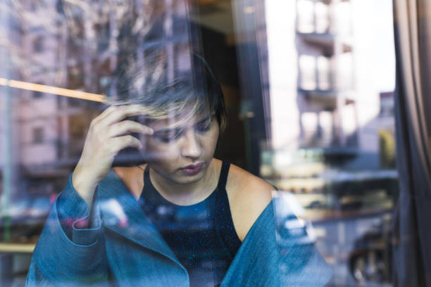 istock Indian woman posing behind a reflecting glass 921674266