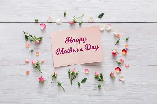 Mother’s day concept with tulips and greeting card
