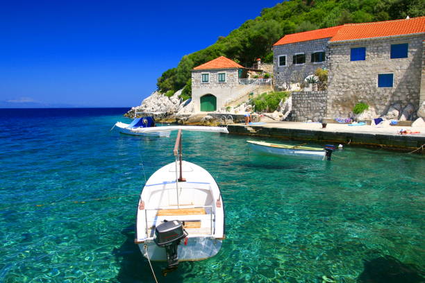 Clear sea and old stone houses on Island Lastovo, Lucica village, Croatia stock photo