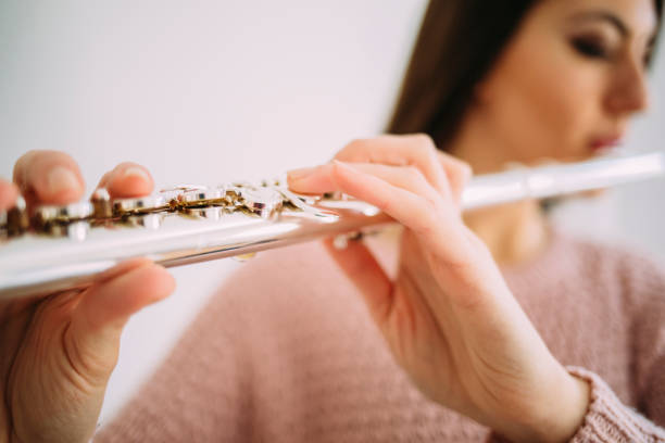 istock Young woman playing the flute. 921677204