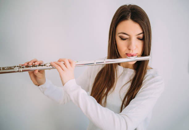istock Female musician playing the flute. 921677218