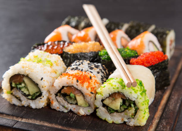 istock Japanese Sushi over black background 921680868