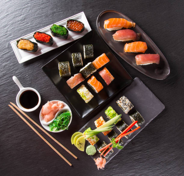 istock Japanese Sushi over black background 921680934
