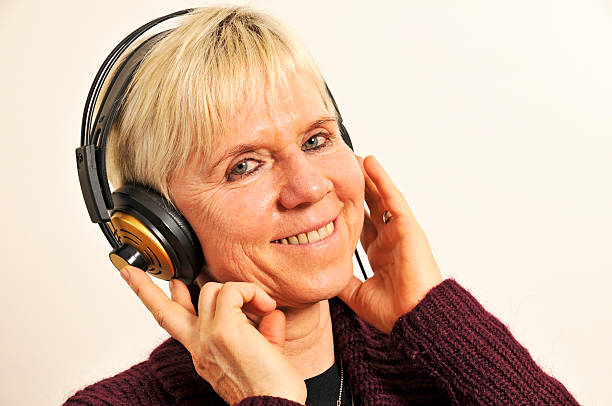smiling woman with headphones stock photo