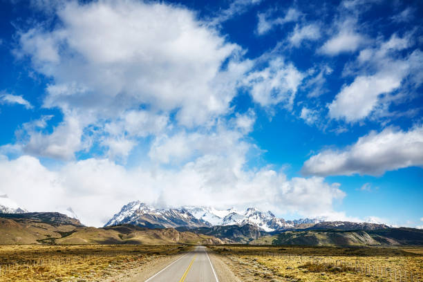 istock Road with Fitz Roy Mountain range, Argentina. 921681278