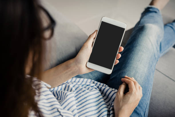 istock Young woman in glasses using smart phone 921682124
