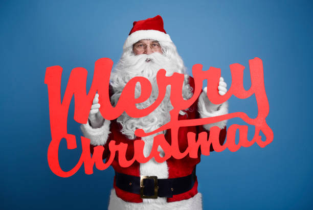 istock Santa Claus with christmassy banner 921691060