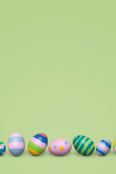 istock Colorful easter eggs on pastel green background 921691160