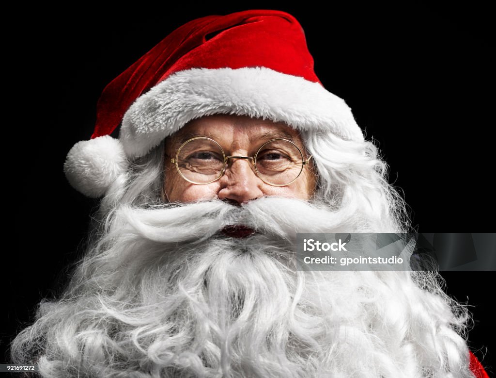 Santa claus's human face on  black background Santa Claus Stock Photo