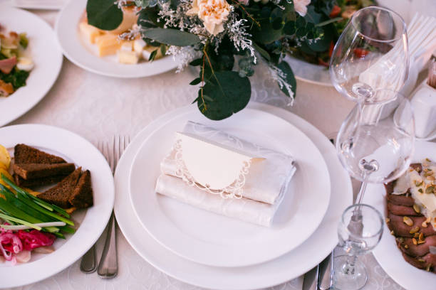 istock Card with guest's name stands on dinner plate 921691638