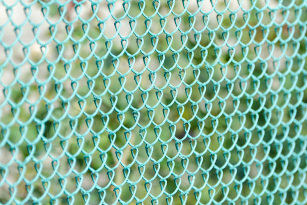 istock Green fence, side view. Green Background 921691670