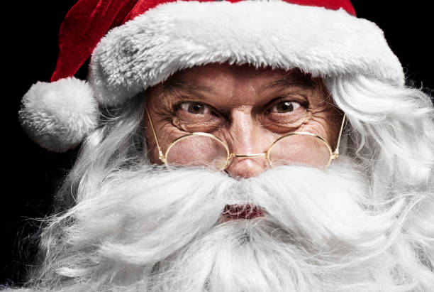 istock Close up of  santa claus's human face 921696206