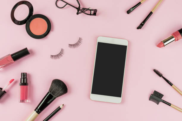 Set of make up brushes and cosmetics with smart phone