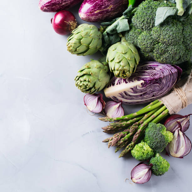 Assortment of organic farmer green and ultra violet vegetables