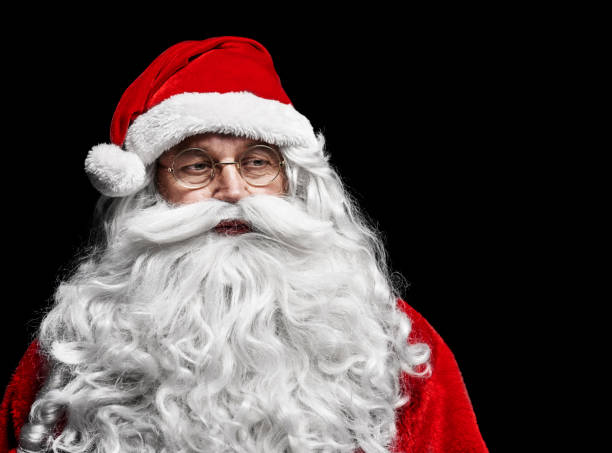 istock Sad and worried santa claus at studio shot 921696832