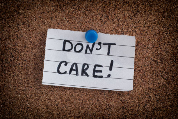 istock Paper note with the phrase Don't Care on bulletin board 921702230