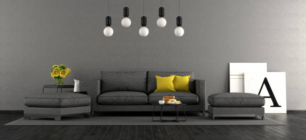 Black and gray living room with sofa and footstools - 3d rendering\n