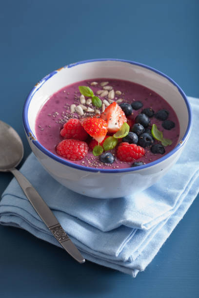 healthy berry smoothie bowl with strawberry blueberry raspberry and chia seed