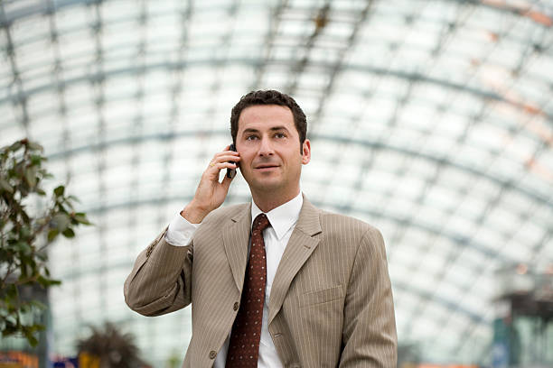 Businessman with cellular horizontal stock photo